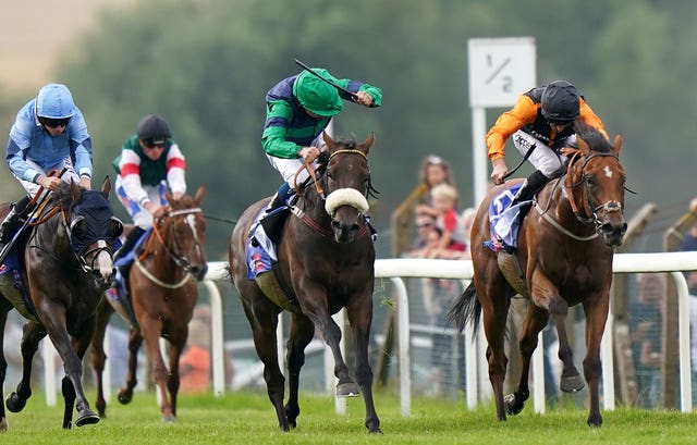 Brunch and William Buick (centre, green) coming home to win the Sky Bet Go-Racing-In-Yorkshire Summer Festival Pomfret Stakes at Pontefract