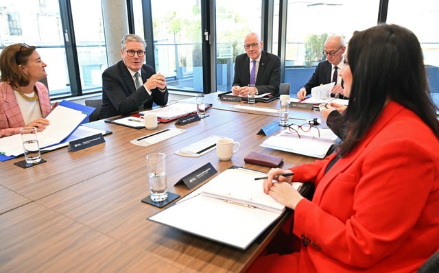 Sir Keir Starmer at a table holding a meeting with devolved national leaders