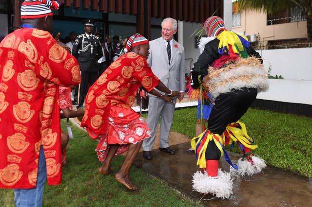 Charles watches some traditional dancing during his visit to the British Council Arts Festival in Lagos, Nigeria