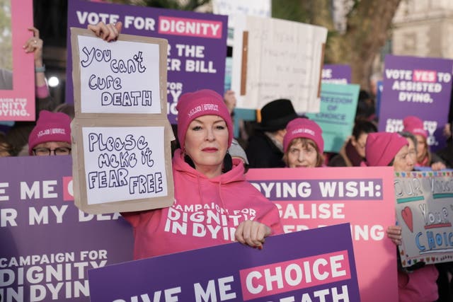 Demonstrators gathered outside Parliament holding placards supporting the assisted dying Bill