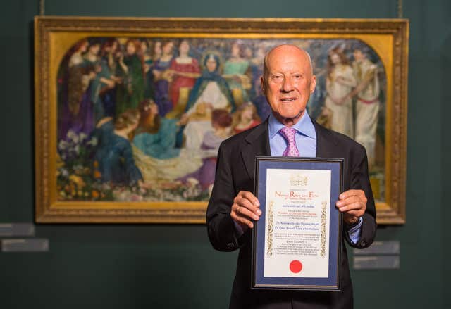 Lord Foster holds a certificate as he receives the Freedom of the City of London in 2017