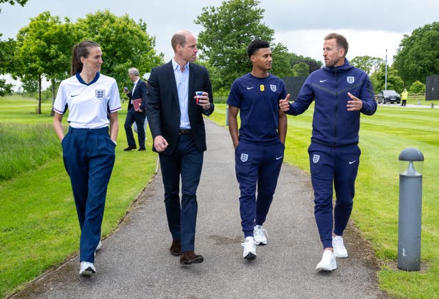 The Prince of Wales, centre, with Jill Scott, left, and Ollie Watkins, centre right, and Harry Kane, right, at St George’s Park