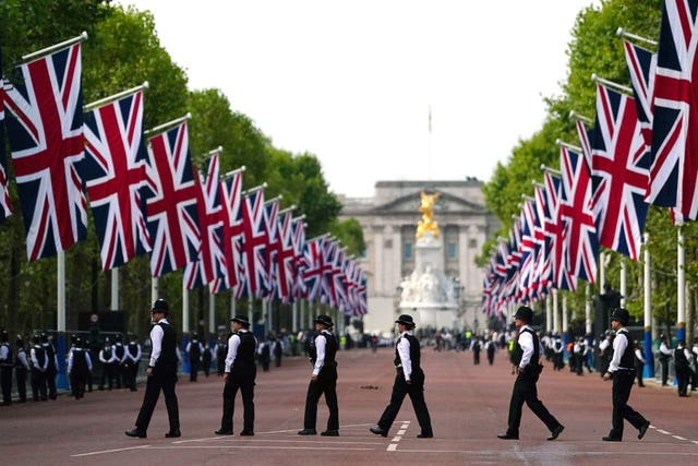 Police officers in The Mall, central London, ahead of the ceremonial procession of the coffin of Queen Elizabeth II from Buckingham Palace to Westminster Hall