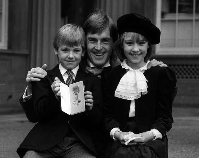 Kenny Dalglish with his children and MBE in 1985