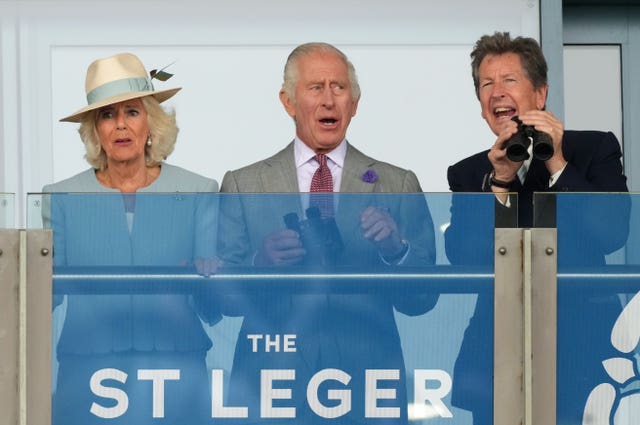 The King and Queen with racing adviser John Warren at Doncaster 