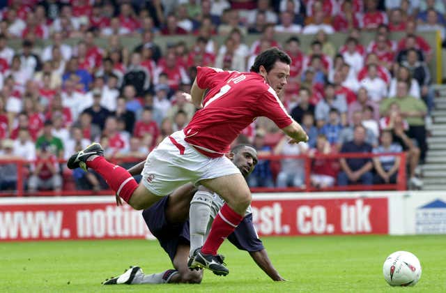 Justin Cochrane tackles Nottingham Forest’s Andy Reid during his time at Crewe