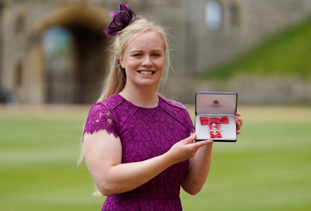 Laura Sugar with her MBE following an investiture ceremony at Windsor Castle 
