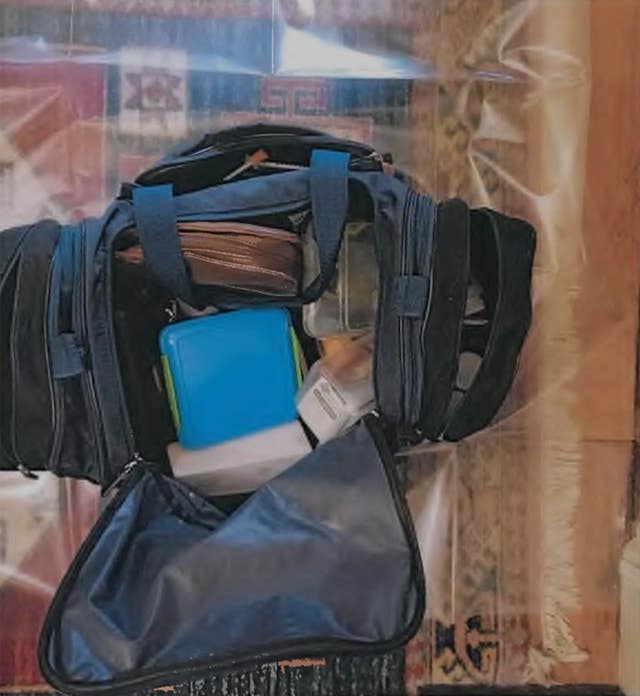 A bag containing a plastic box 