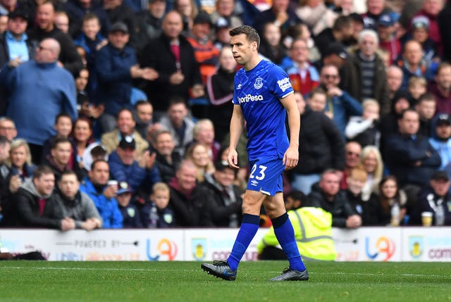 Seamus Coleman walks off the pitch after being shown the red card 