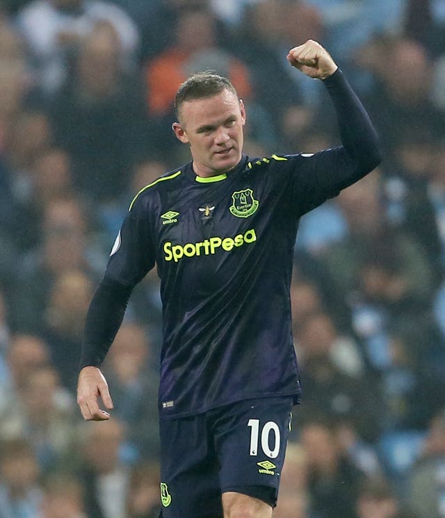 Wayne Rooney celebrates his 200th Premier League goal
