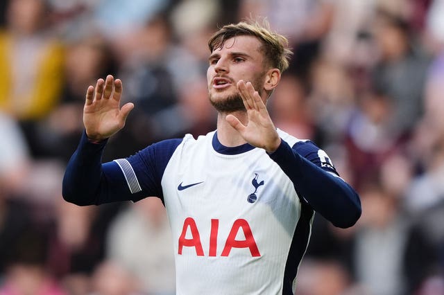 Tottenham forward Timo Werner raises his hands in frustration