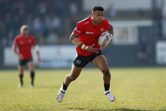 St Helens star Regan Grace runs with the ball