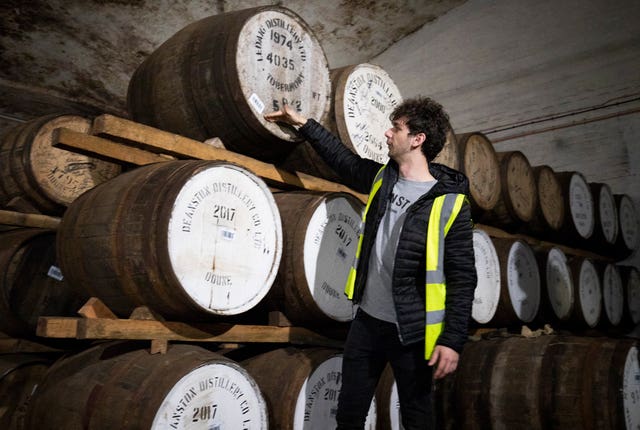 Ronnie Brodie at Deanston Distillery in Doune, checks the casks of their Highland Single Malts