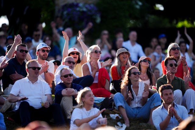 Spectators on the hill watching Cameron Norrie in action