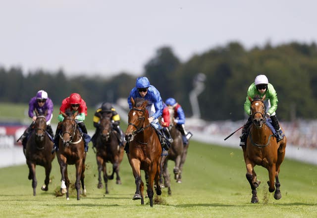 Fairy Cross (centre) ridden by jockey William Buick on their way to winning the William Hill Prestige Fillies’ Stakes at Goodwood