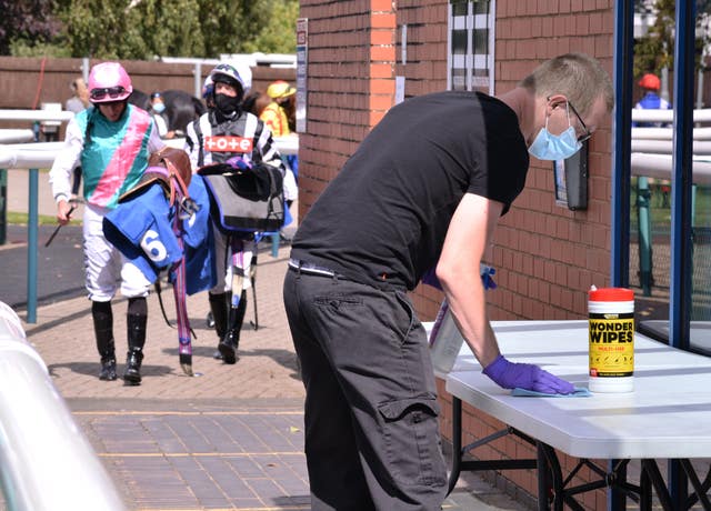 A saddle table is cleaned at Leicester racecourse