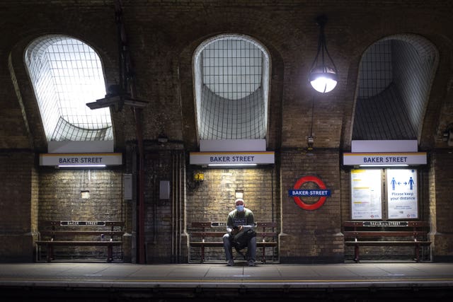 A man wearing a face mask in Baker Street tube station