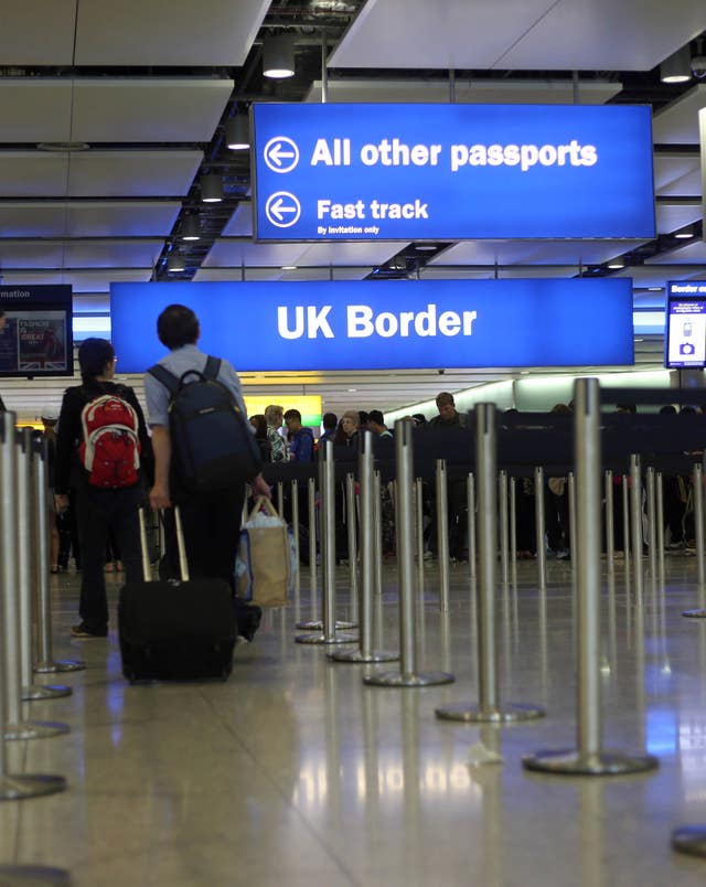 Passengers going through the UK border at Heathrow Airport