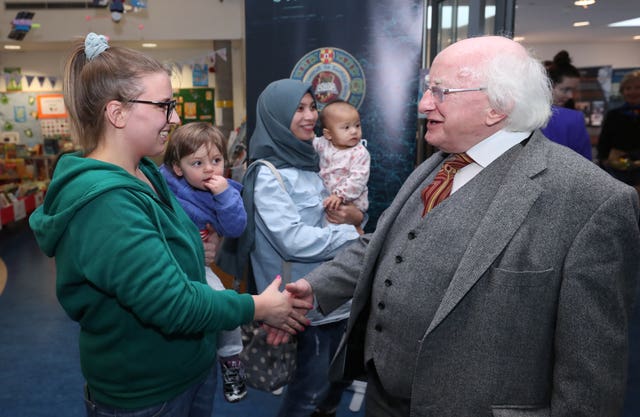 Michael D Higgins donates books to library