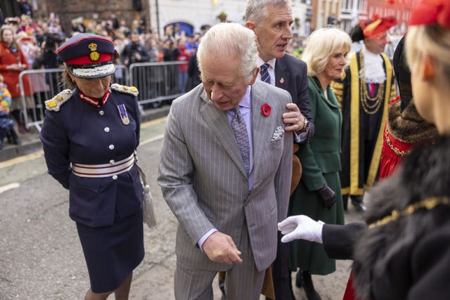 Charles barely reacted after an egg is thrown in his direction at Micklegate Bar