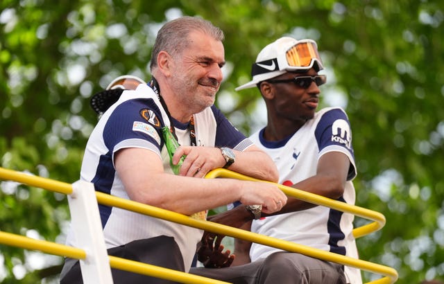 Tottenham manager Ange Postecoglou on the open-top team bus