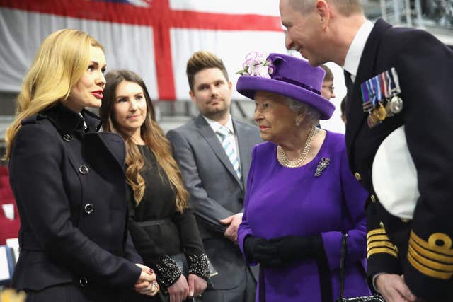 The Queen with singer Katherine Jenkins and Commodore Jerry Kyd during the commissioning of HMS Queen Elizabeth, Britain’s biggest and most powerful warship, into the Royal Navy Fleet at Portsmouth Naval Base in 2017