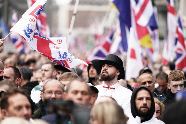 Supporters of a rally endorsed by Tommy Robinson march from Victoria Station to Parliament Square in central London. 