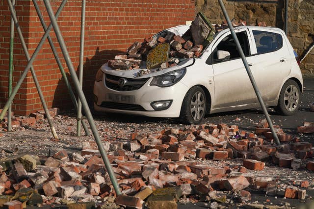 A car crushed by fallen bricks in Seaton Sluice, Northumberland after strong winds from Storm Malik battered northern parts of the UK
