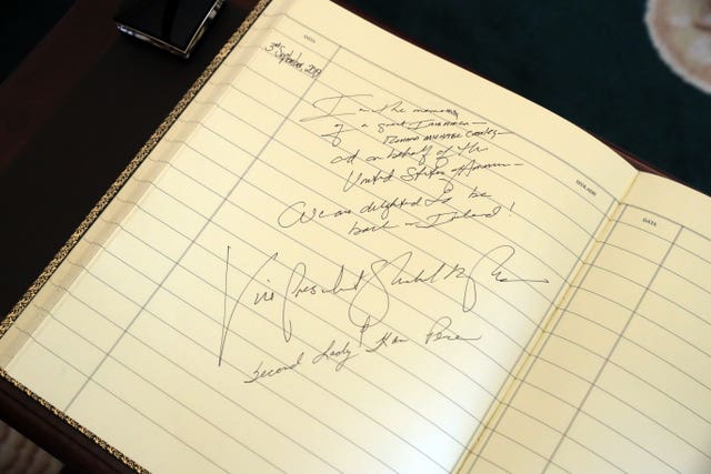The guestbook signed by Mr Pence