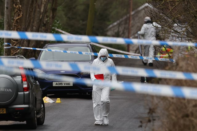 PSNI forensic officers in Omagh, where John Caldwell was shot