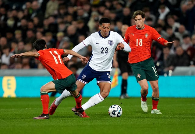 England Under-21s' Jobe Bellingham, centre, dribbles past Portugal’s Tiago Tomas, left, and Gustavo Sa