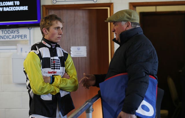 Trainer Paul Nicholls and Harry Cobden 