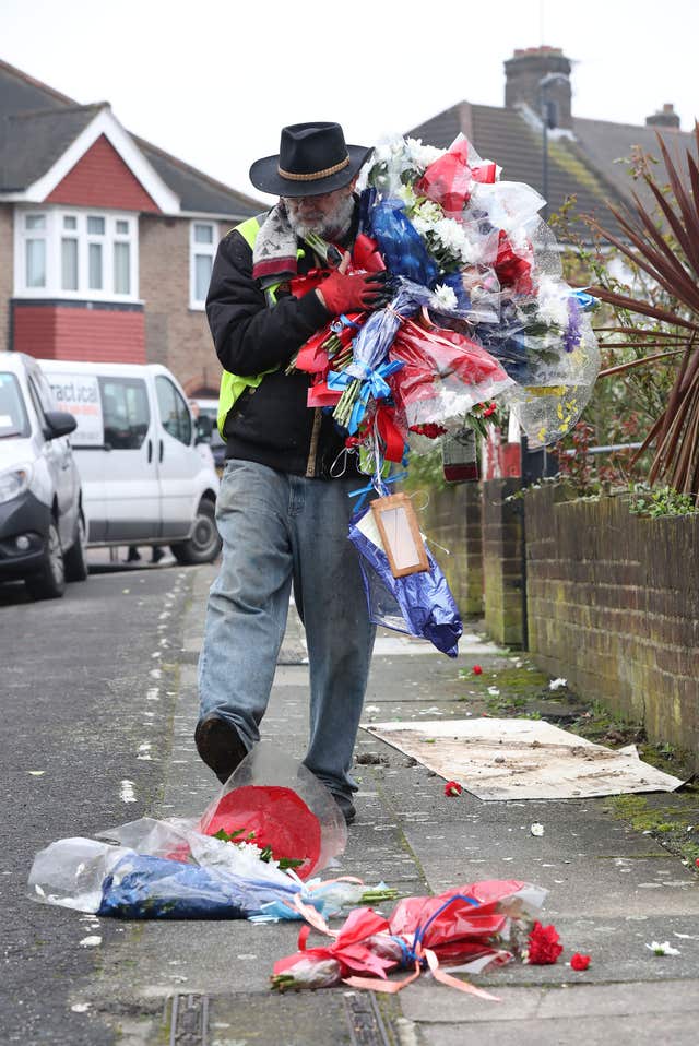 Iain Gordon kicks flowers as he takes them away (Gareth Fuller/PA)