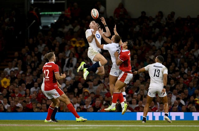 Freddie Steward, centre left, claims a high ball against Wales