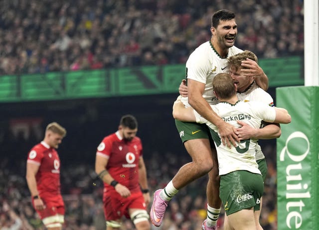 South Africa’s Ethan Hooker (right) celebrates scoring