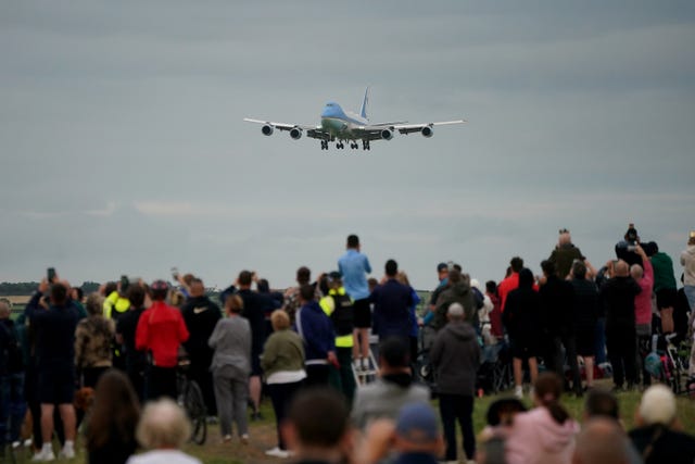 People watch Air Force One land