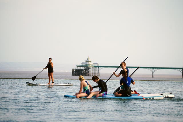 People on paddle boards on Clevedon Marine Lake in Clevedon