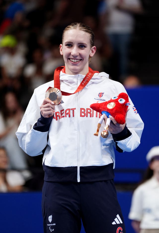 Louise Fiddles on the podium