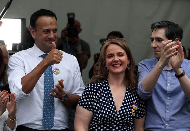 Leo Varadkar (left), Simon Harris (right) and Senator Catherine Noone celebrate at Dublin Castle (Brian Lawless/PA)
