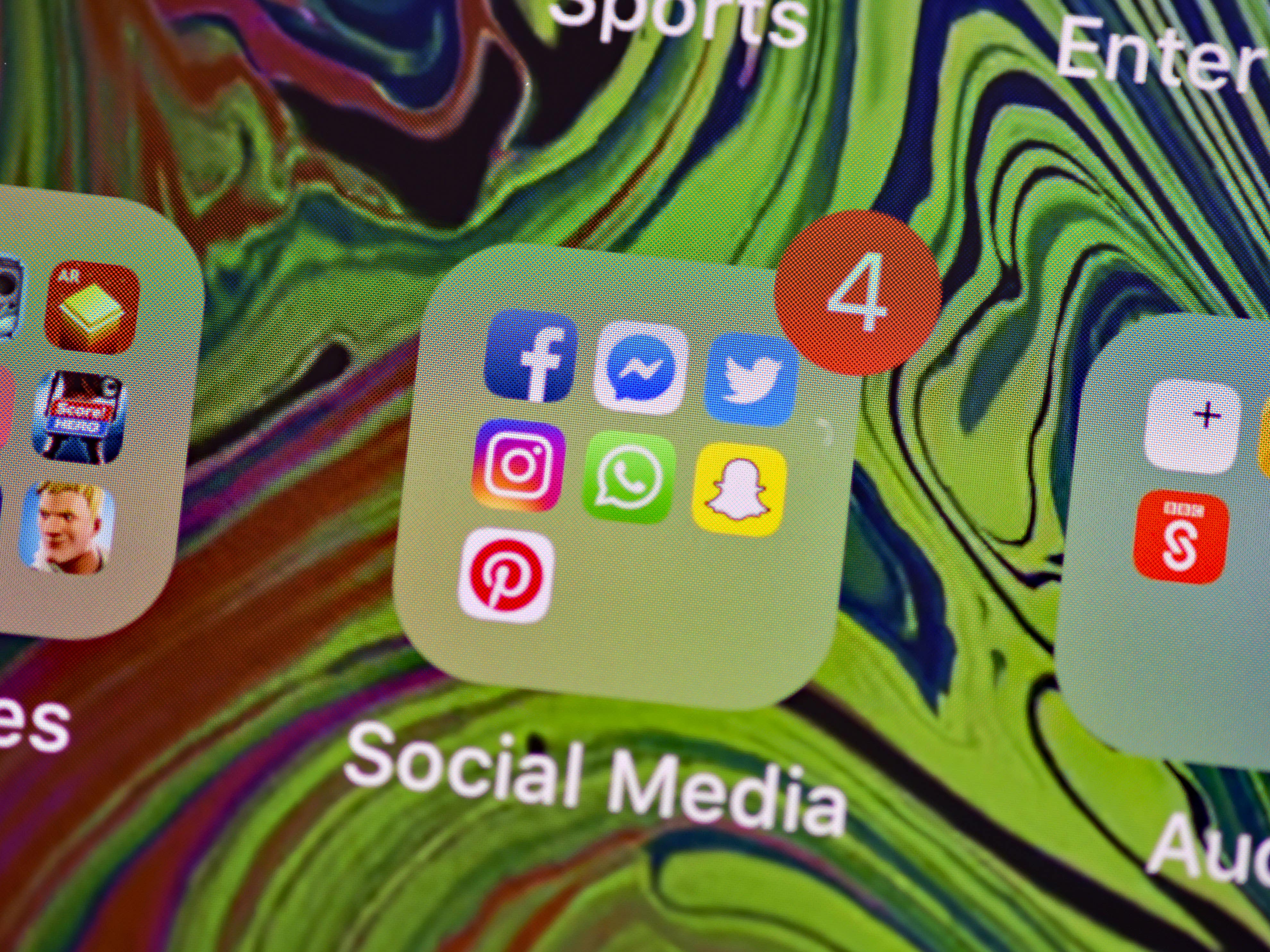 A picture of a mobile phone with social media apps