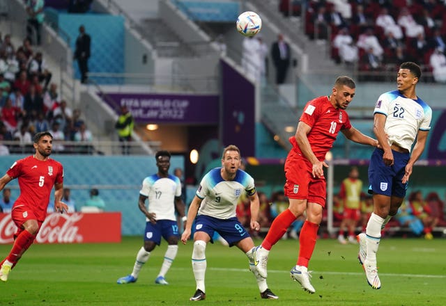 Jude Bellingham, right, headed England's opening goal at Qatar 2022 in their group win against Iran