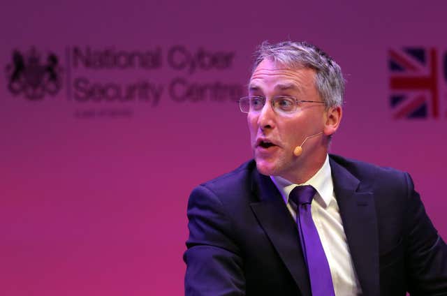 A man, Ciaran Martin, speaking at a conference