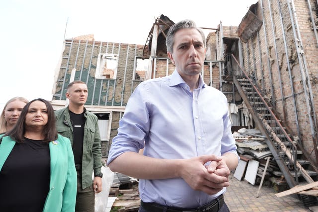 Taoiseach Simon Harris during a visit to inspect a bombed-out house in Hostomel, Ukraine