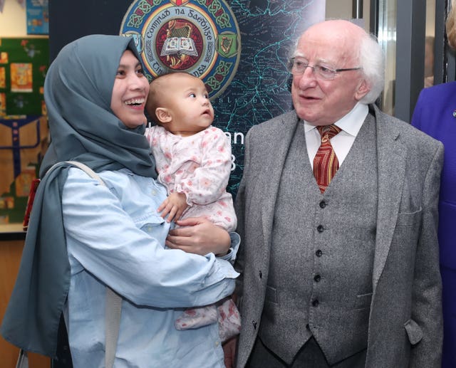 Michael D Higgins donates books to library