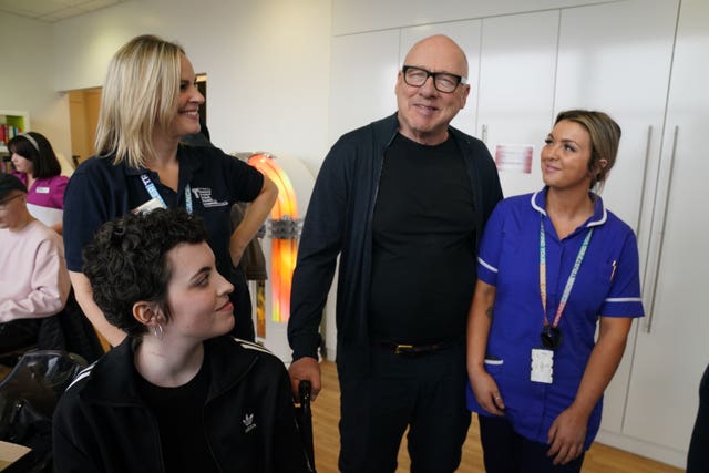 Mark Knopfler meeting nurses and staff during his visit