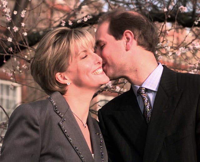 Edward kisses a smiling Sophie on the cheek at their engagement photocall in the gardens of St James's Palace 