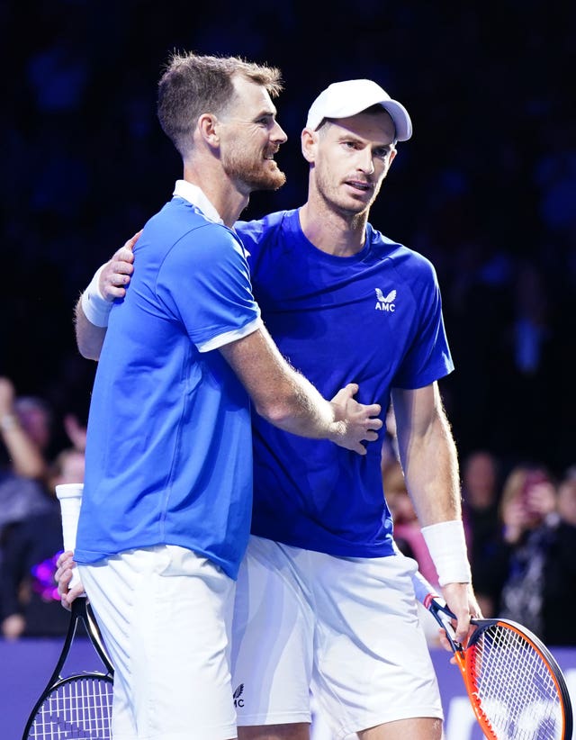 Jamie, left, and Andy Murray embrace
