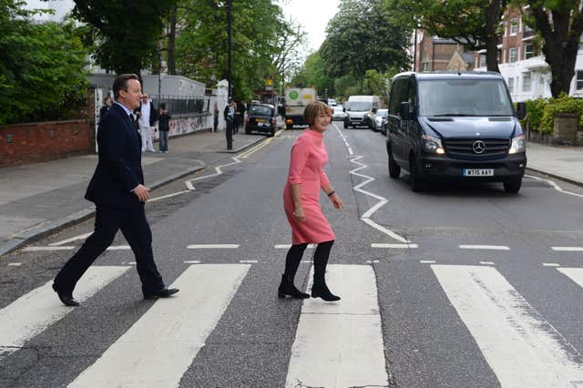 Prime Minister David Cameron with Labour’s former culture secretary Tessa Jowell trying to recreate the famous Beatles album cover during their visit to Abbey Road studios in north London in 2016 (Jeremy Selwyn/Evening Standard)