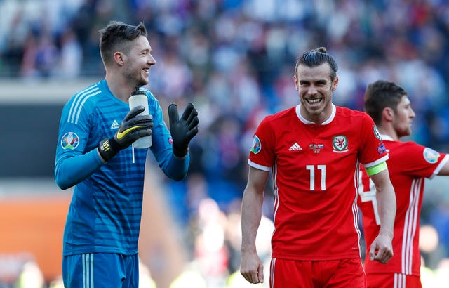 Wales goalkeeper Wayne Hennessey, left, was kept busy by Slovakia in the closing stages