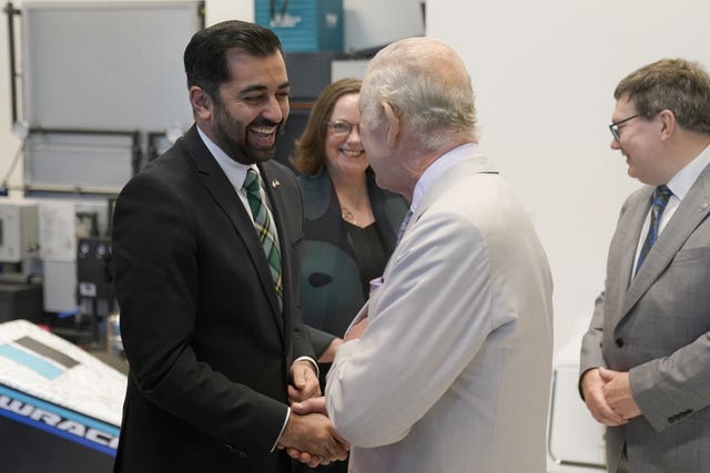 Charles also had a warm embrace with Scotland's First Minister, Humza Yousaf (Andrew Matthews/PA)